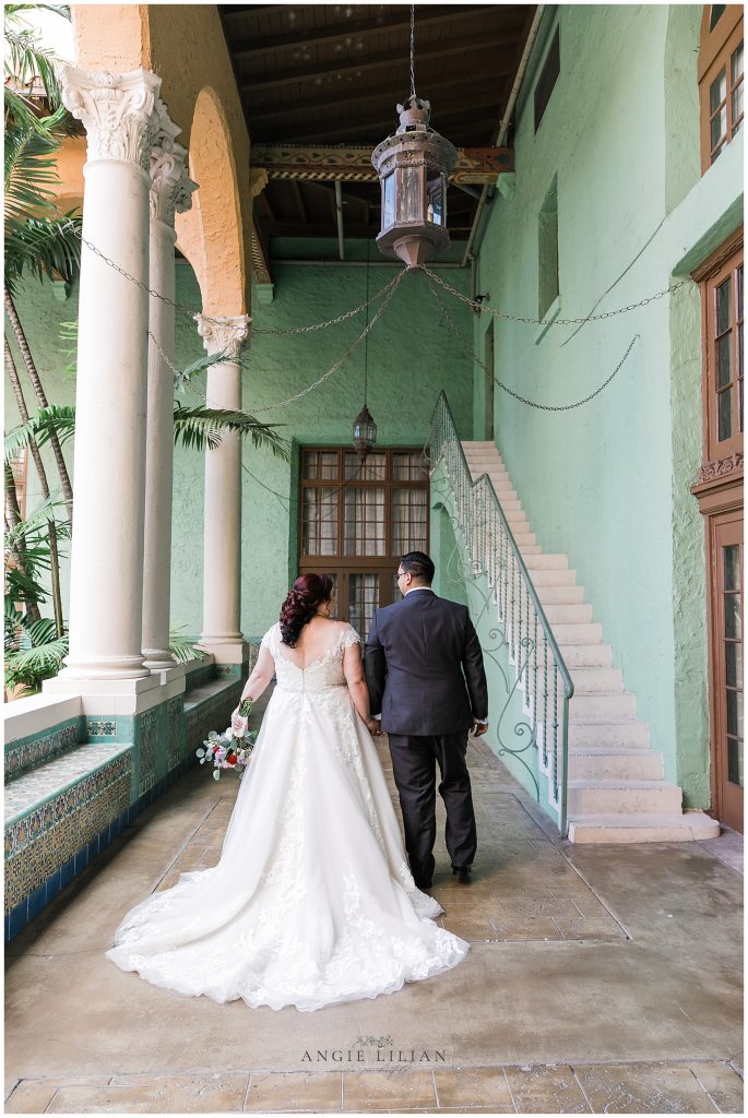 bride and groom walking away. Photo by Angie Lilian