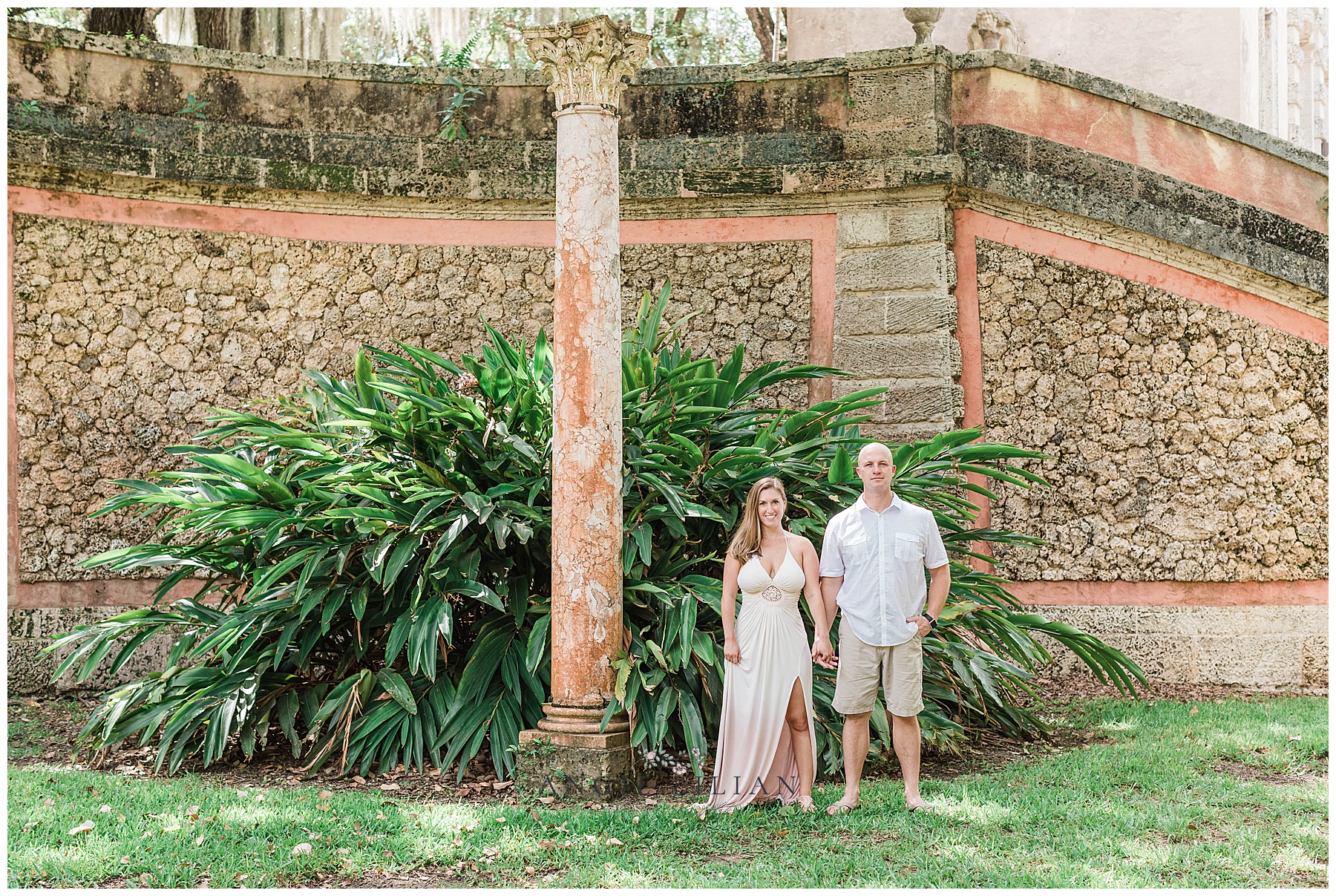 couple standing next to each other at a garden